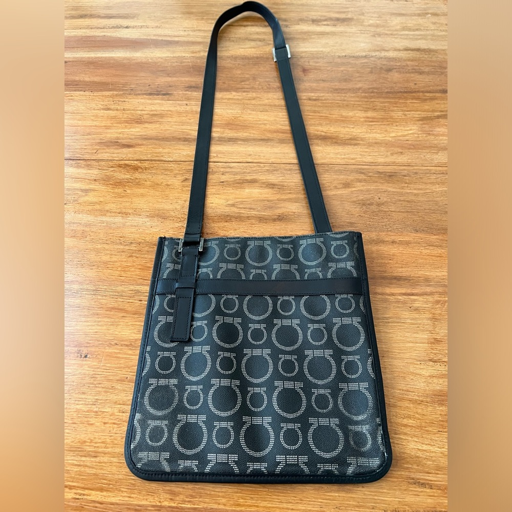 SALVATORE FERRAGAMO Gancini Messenger Cross Body in printed coated canvas.